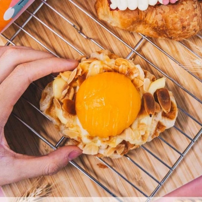 Peach tart at the top of a metal grill