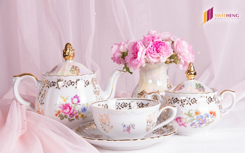 Pink and gold tea set in a tea party